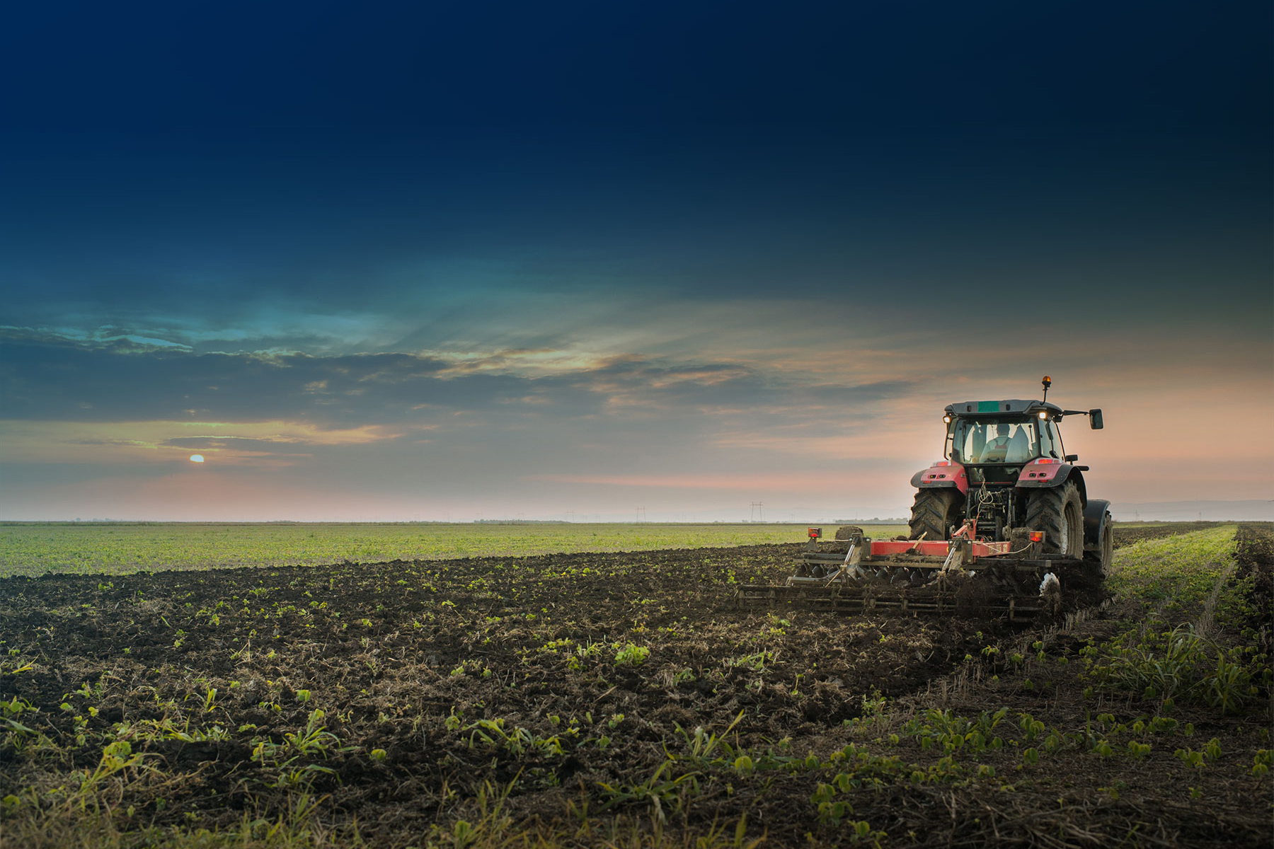 Tractor ploughing agricultural field